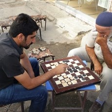 Draughts champion (on right) and local barber